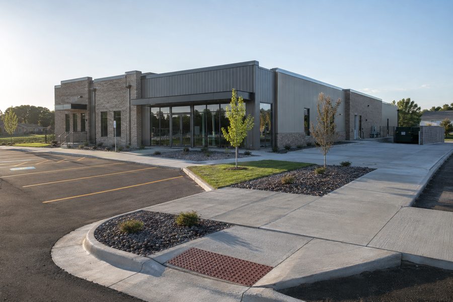 Commercial concrete sidewalks, curb and ADA ramp at a Sioux Falls, SD business