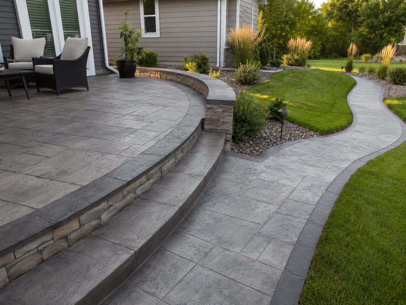 Stamped concrete patio with curved steps and walkway in Sioux Falls, SD